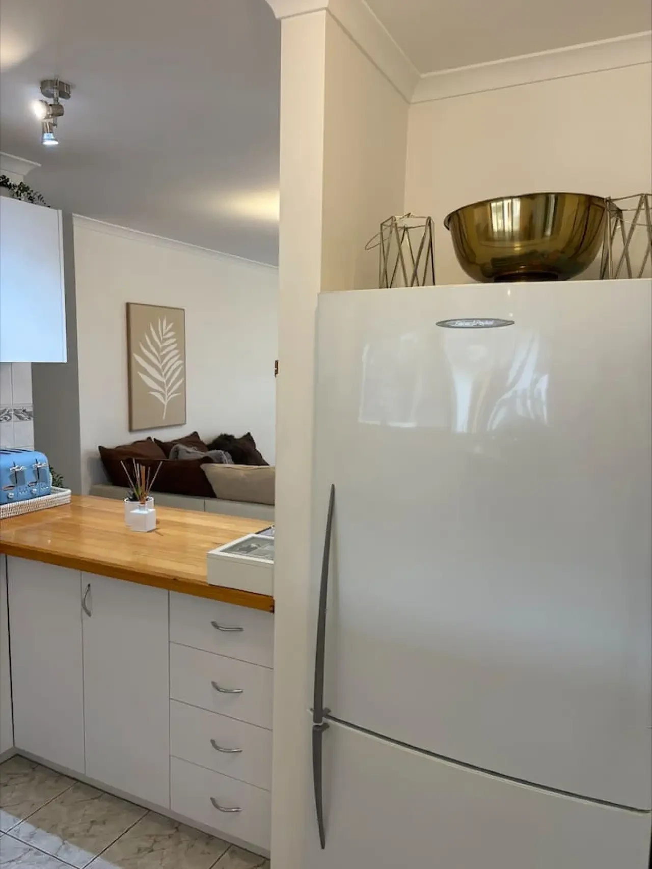 Pine Lea Lodge kitchen with fridge and living area