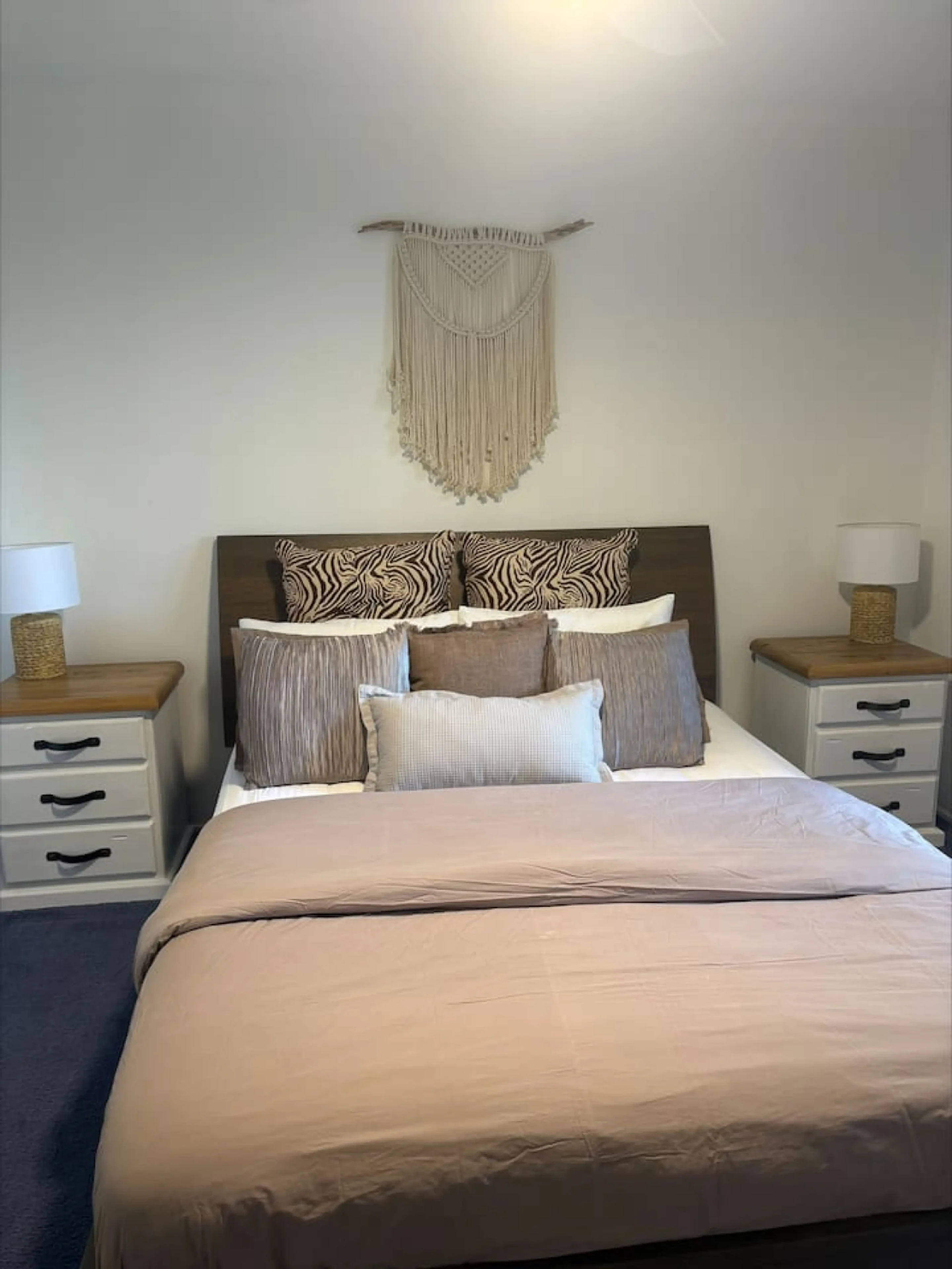 Pine Lea Lodge master bedroom with macrame wall art