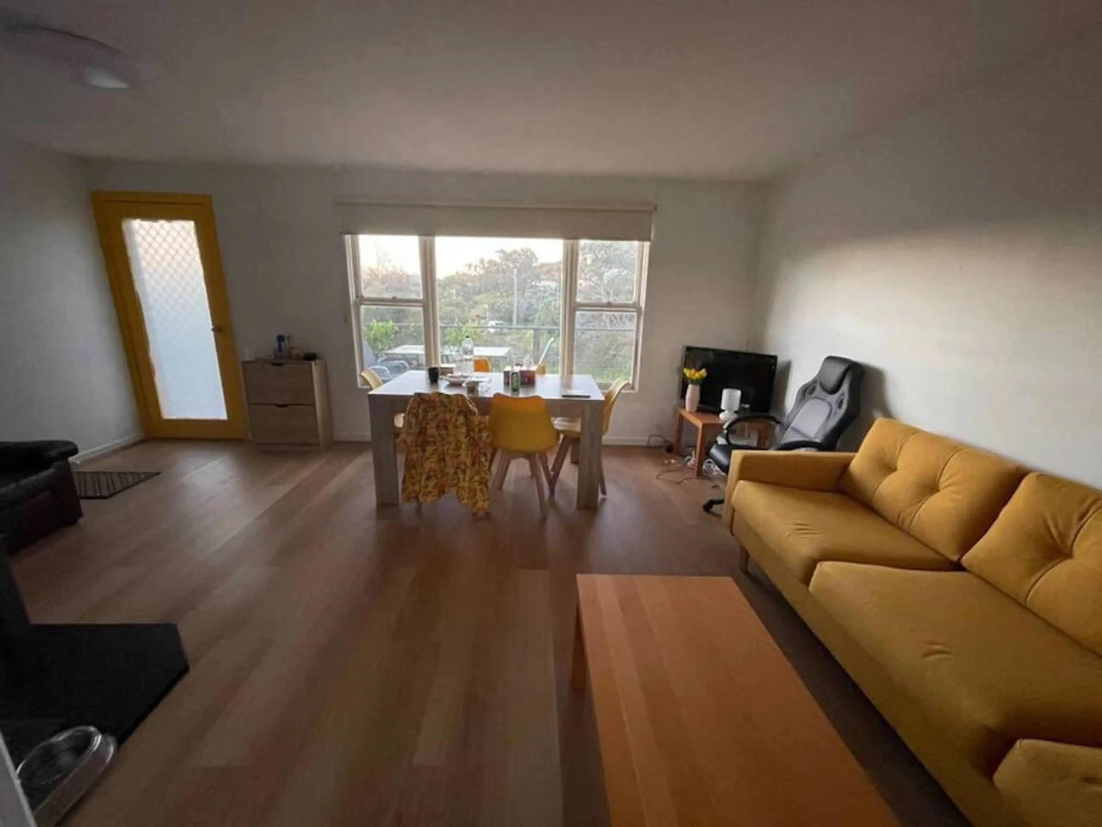 Cosy Tin Shack open plan living and dining area