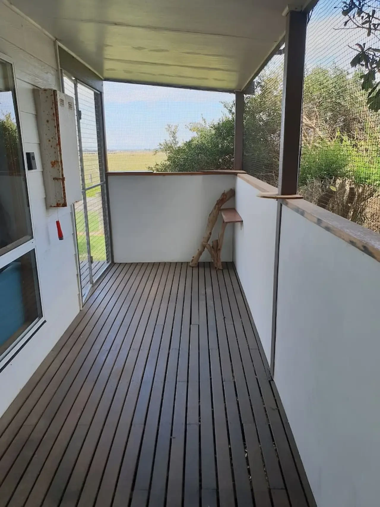 Far View enclosed verandah with timber decking and paddock views
