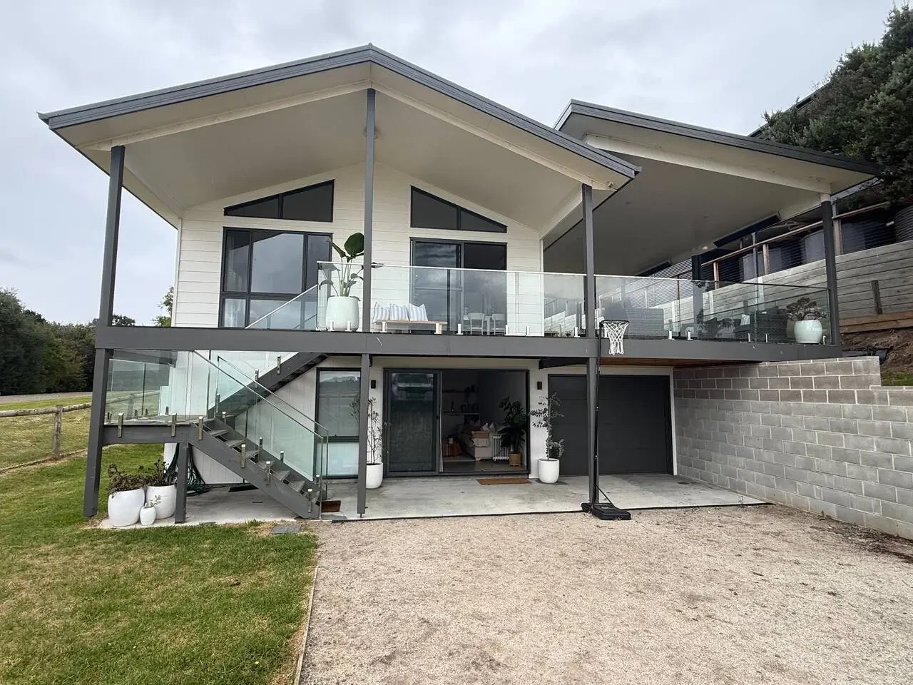 Lancaster Lodge modern two-storey exterior with glass railings and staircase