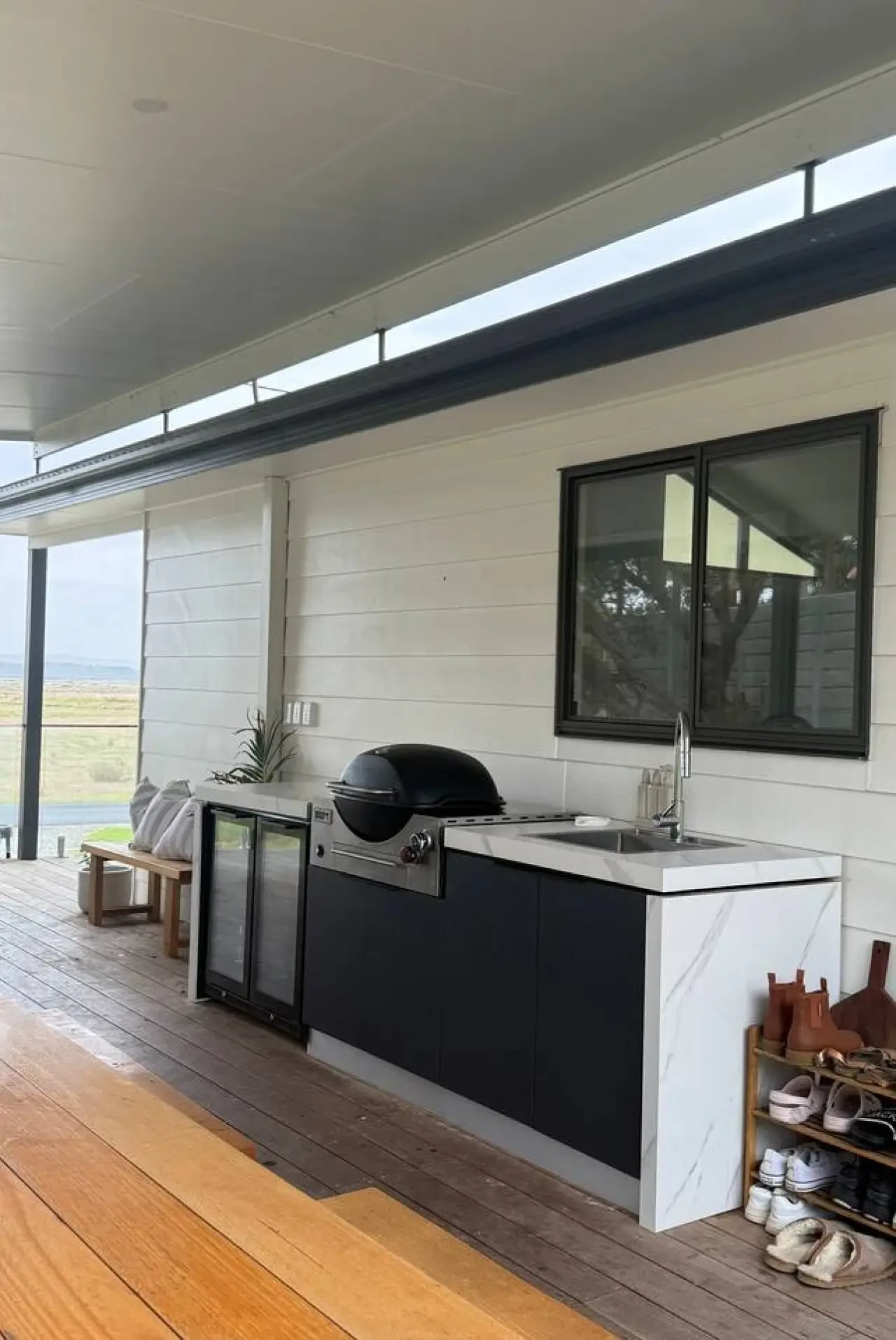 Lancaster Lodge outdoor kitchen with Weber BBQ and marble benchtop