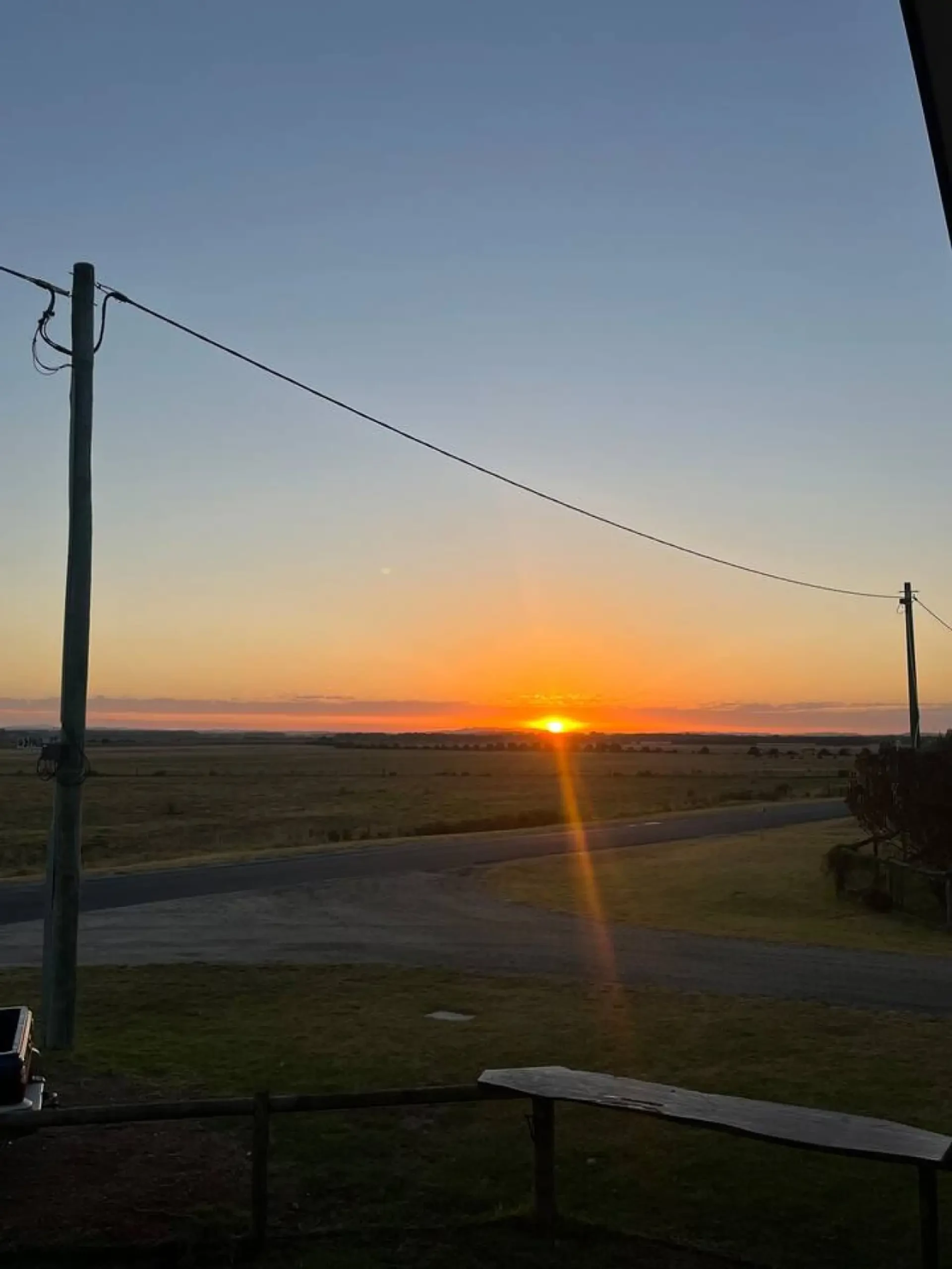 Lancaster Lodge sunset view over open paddocks