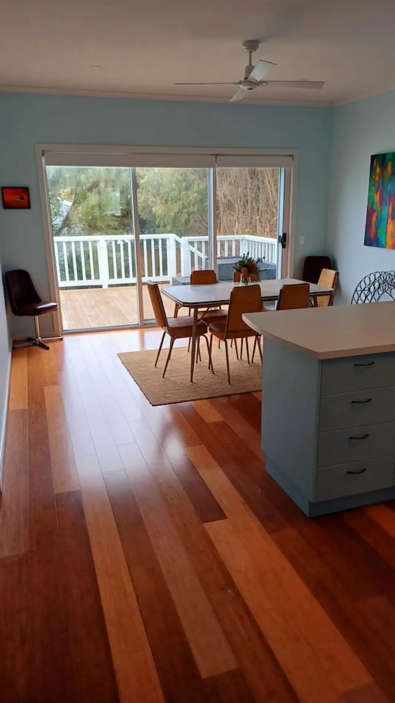 Ocean Blue — open plan dining and kitchen with deck view