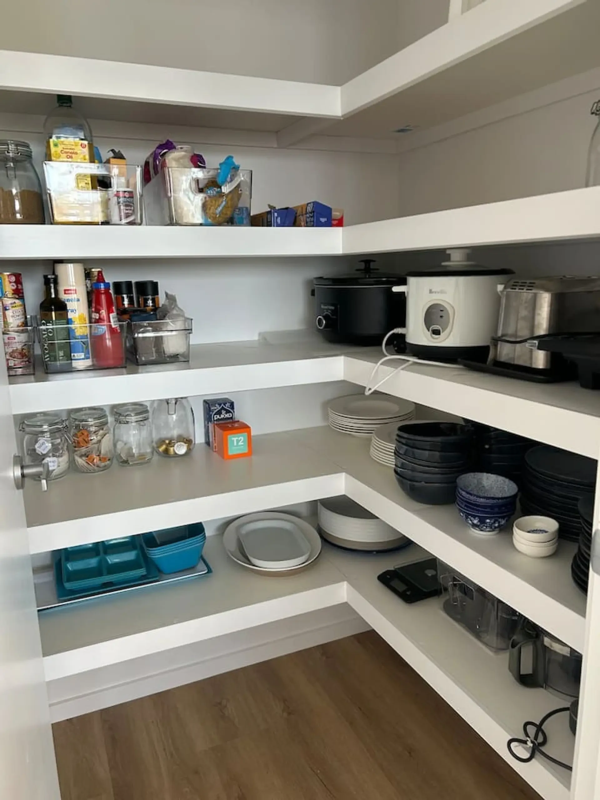 Roo Views walk-in pantry with appliances and crockery