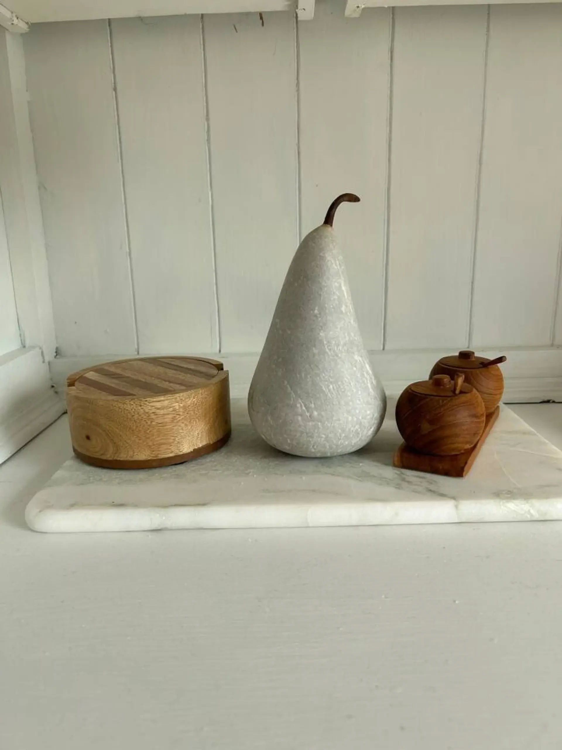 Roo Views kitchen windowsill with marble board and decorative objects