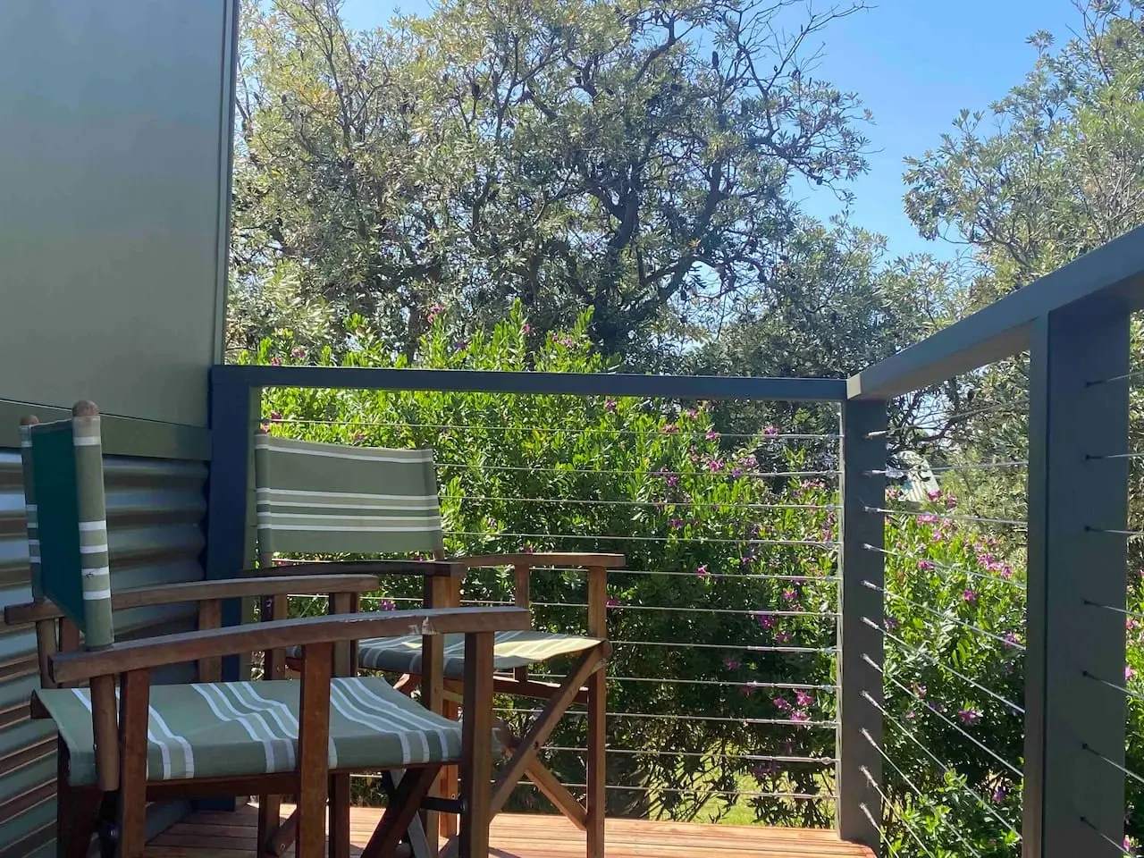 Witjweri deck with striped chairs and garden views