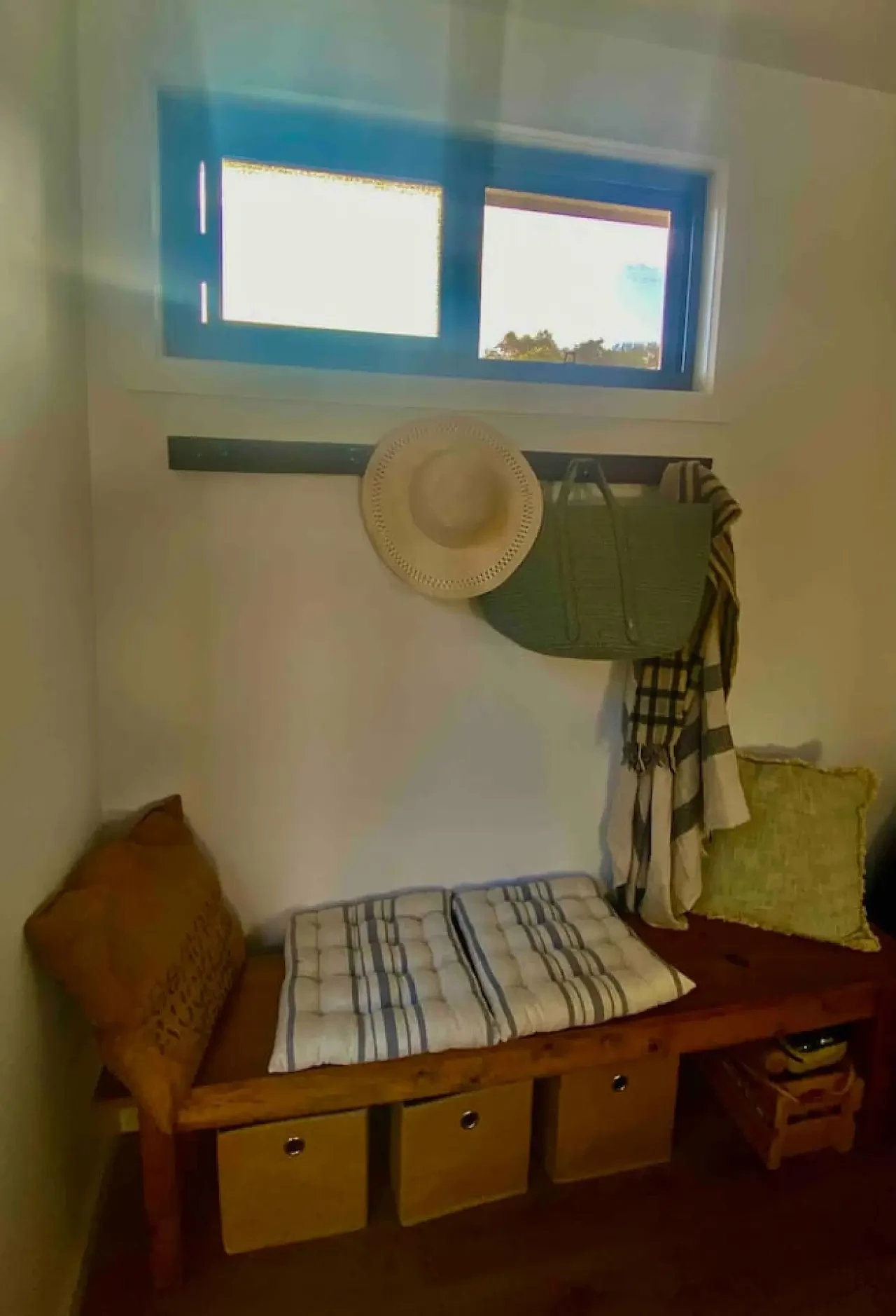 Entry mudroom with storage bench, hooks and beach gear