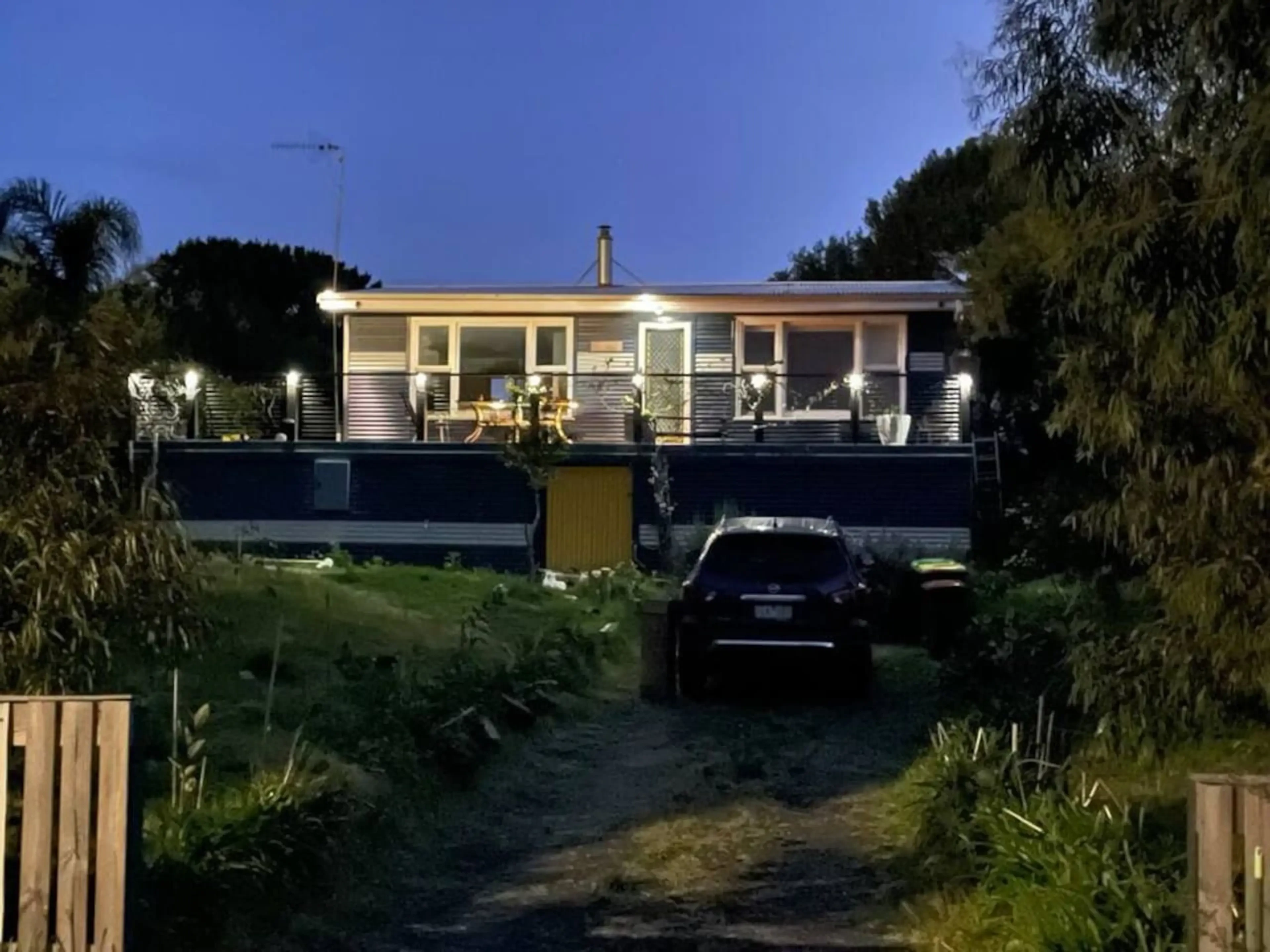 Cosy Tin Shack holiday home at night
